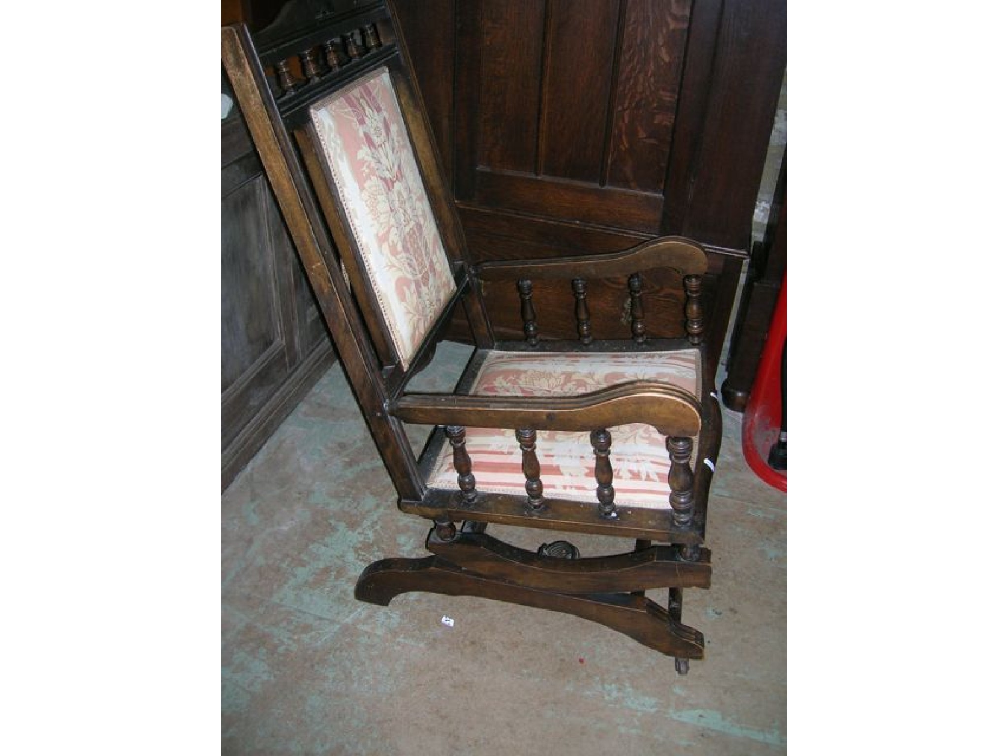 Appraisal: A late Victorian Edwardian American rocking chair with stained beechwood