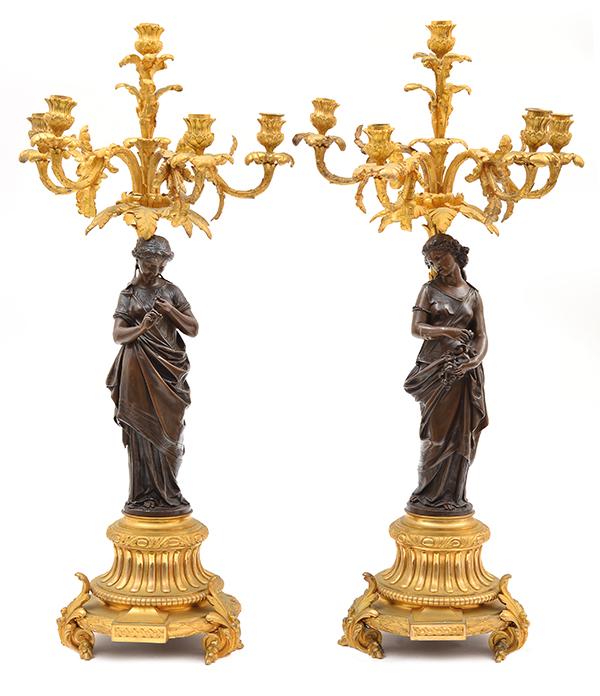 Appraisal: A PAIR OF FRENCH BRONZE AND GILT BRONZE CANDELABRA