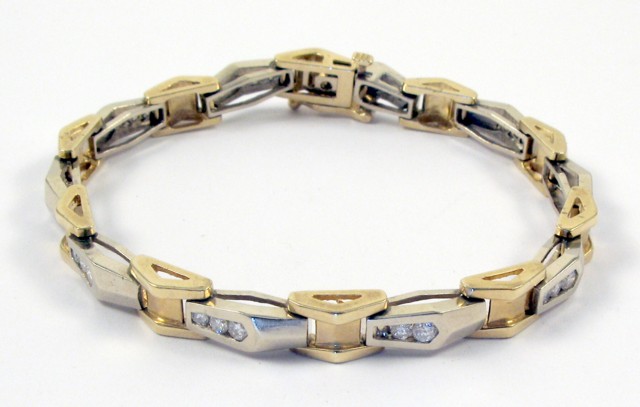 Appraisal: DIAMOND AND FOURTEEN KARAT GOLD BRACELET in length and set