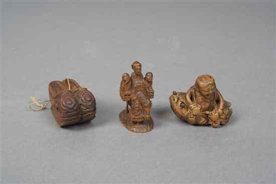 Appraisal: Three Japanese Wood Netsuke one example having three figures on