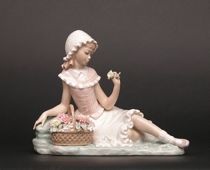 Appraisal: Lladro Young Girl with Flowers Lladro figurine depicts a young