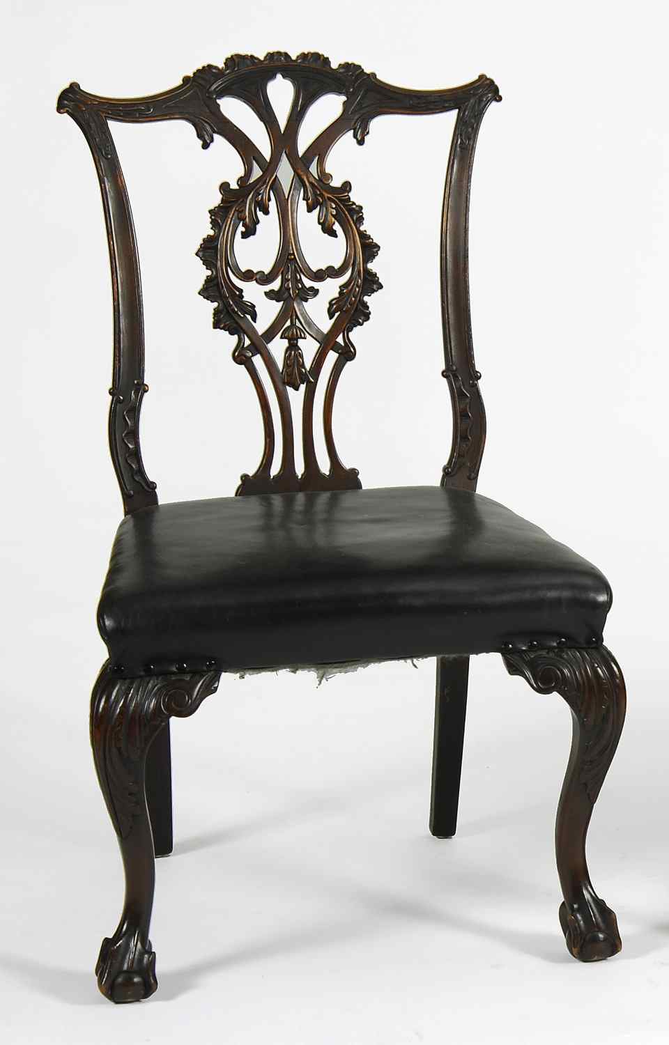 Appraisal: THREE REPRODUCTION GEORGIAN CHIPPENDALE CHAIRSWith carved top rails voluted ears