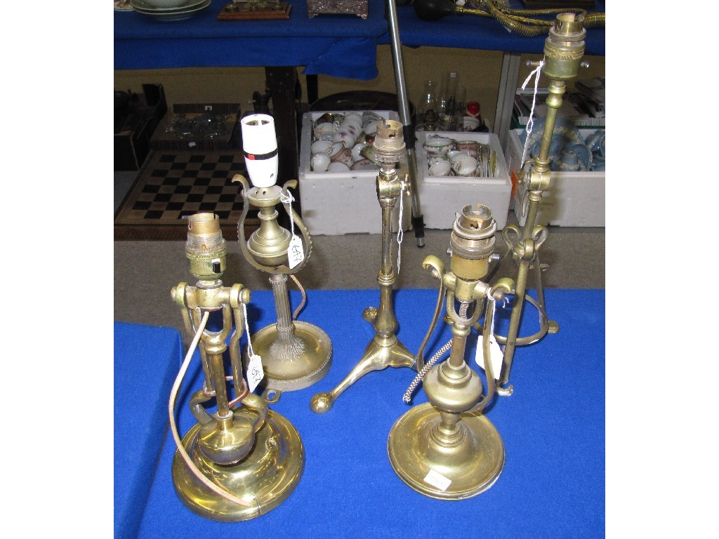 Appraisal: Lot comprising three gimble brass lamps Benson style lamp and