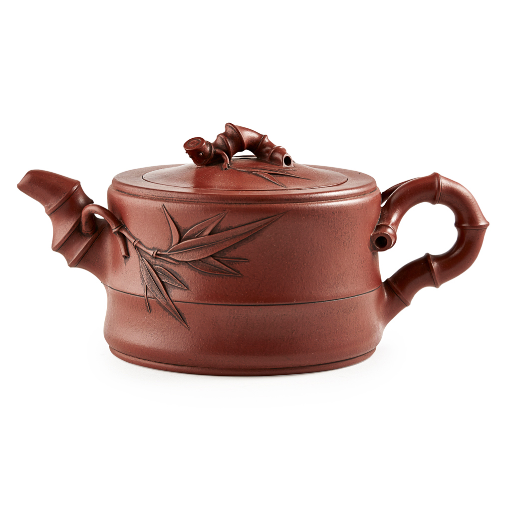 Appraisal: YIXING STONEWARE TEAPOT AND COVER AFTER ZHU KEXIN the handle