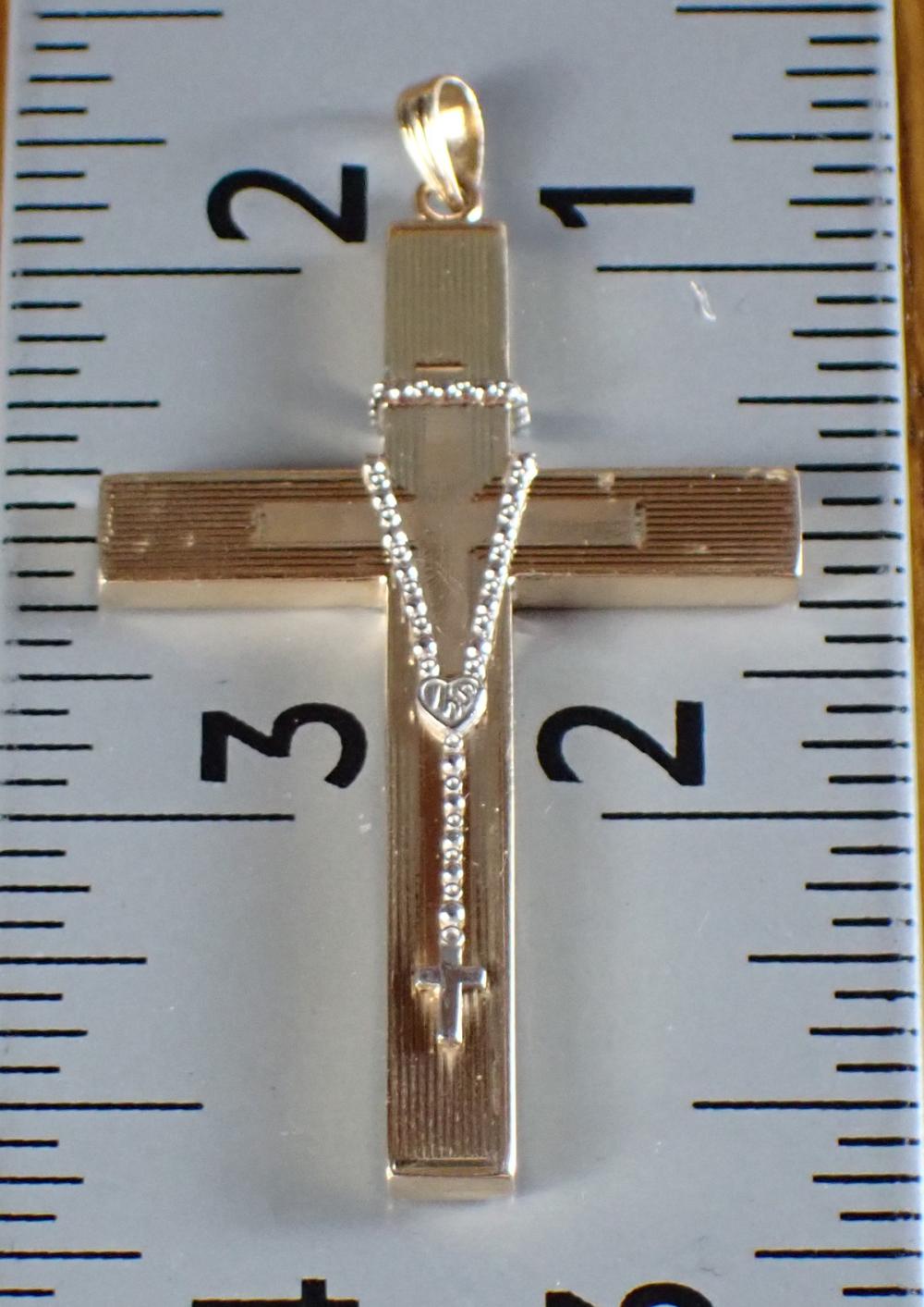 Appraisal: TEN KARAT TWO-TONE GOLD CROSS PENDANT The k yellow gold