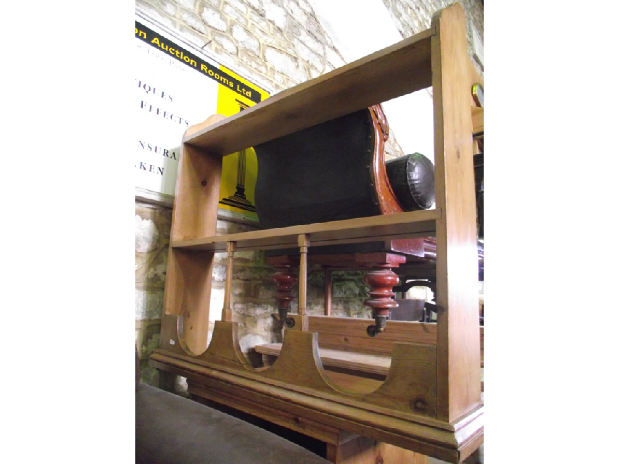 Appraisal: A stripped and waxed pine side cupboard partially enclosed by