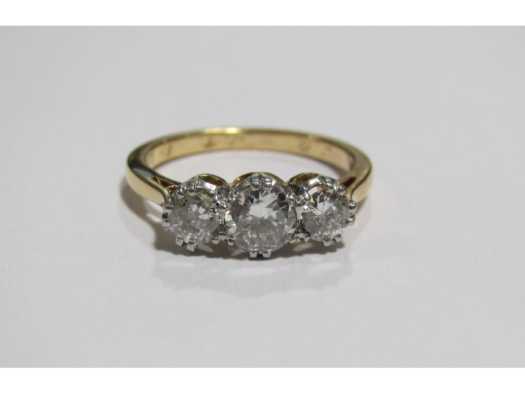 Appraisal: An eighteen carat gold diamond three stone ring with three