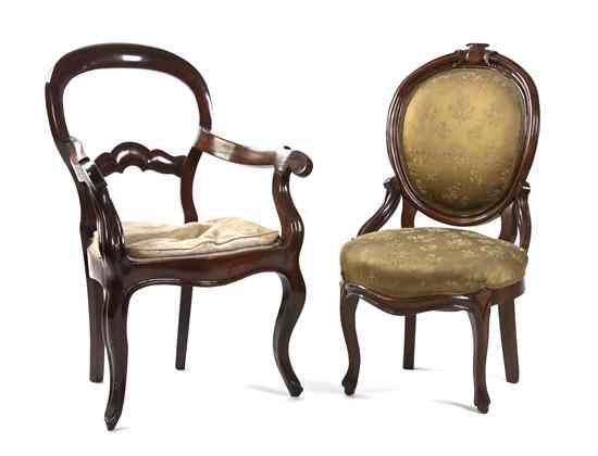 Appraisal: Two Associated Victorian Chairs comprising a balloon back open armchair