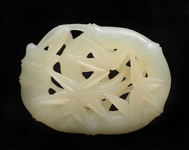 Appraisal: A Chinese white jade pendant th Centurycarved as entwined bamboo