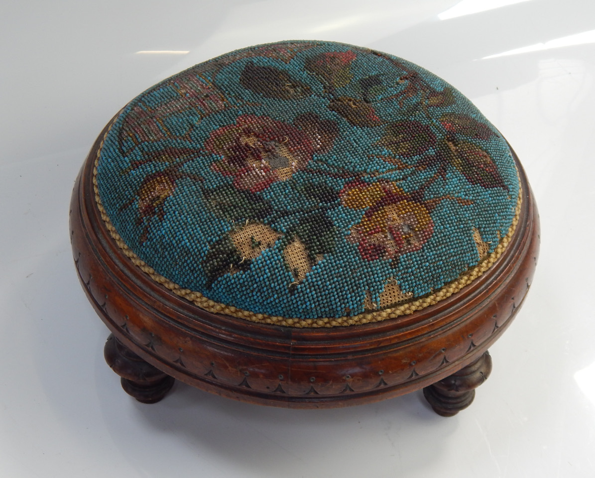 Appraisal: A Victorian mahogany beadwork footstool cm diameter