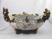 Appraisal: A ceramic continental centrepiece pierced oval bowl with hand painted