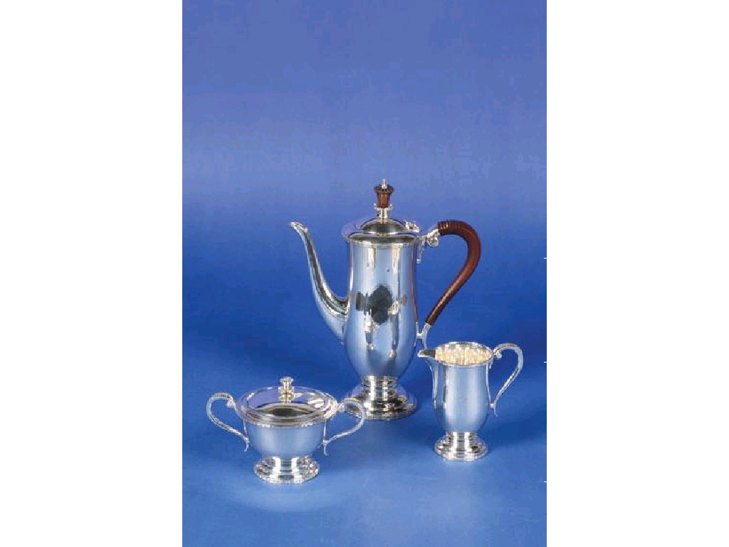 Appraisal: A THREE PIECE TEA COFFEE SET of elongated circular form