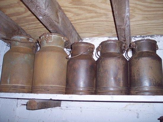 Appraisal: A set of three small churns with swing handles cm