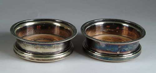 Appraisal: PAIR OF SHEFFIELD SILVER PLATED WINE COASTERS Wood turned bases