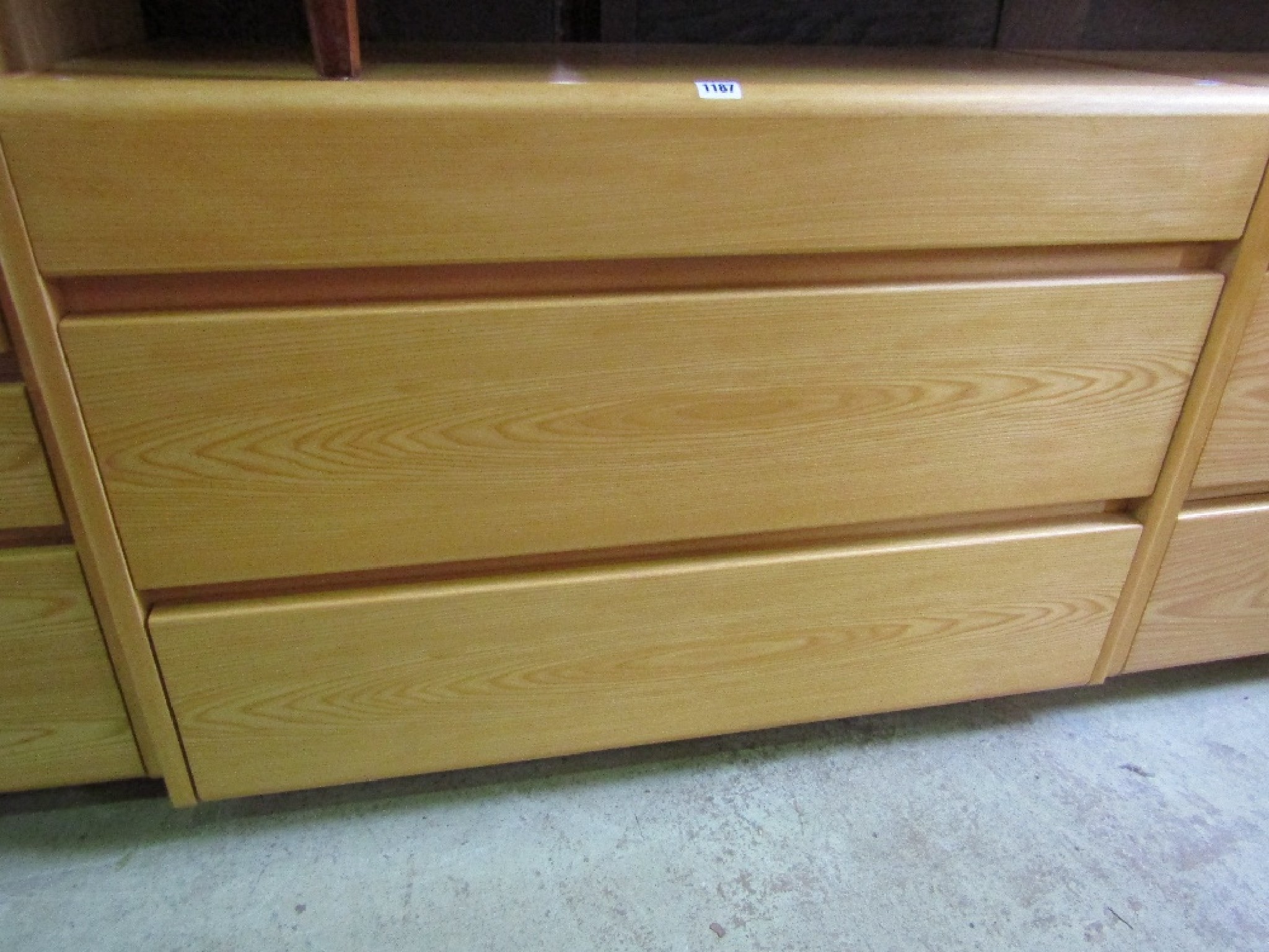 Appraisal: A pair of contemporary ash veneered three drawer bedroom chests