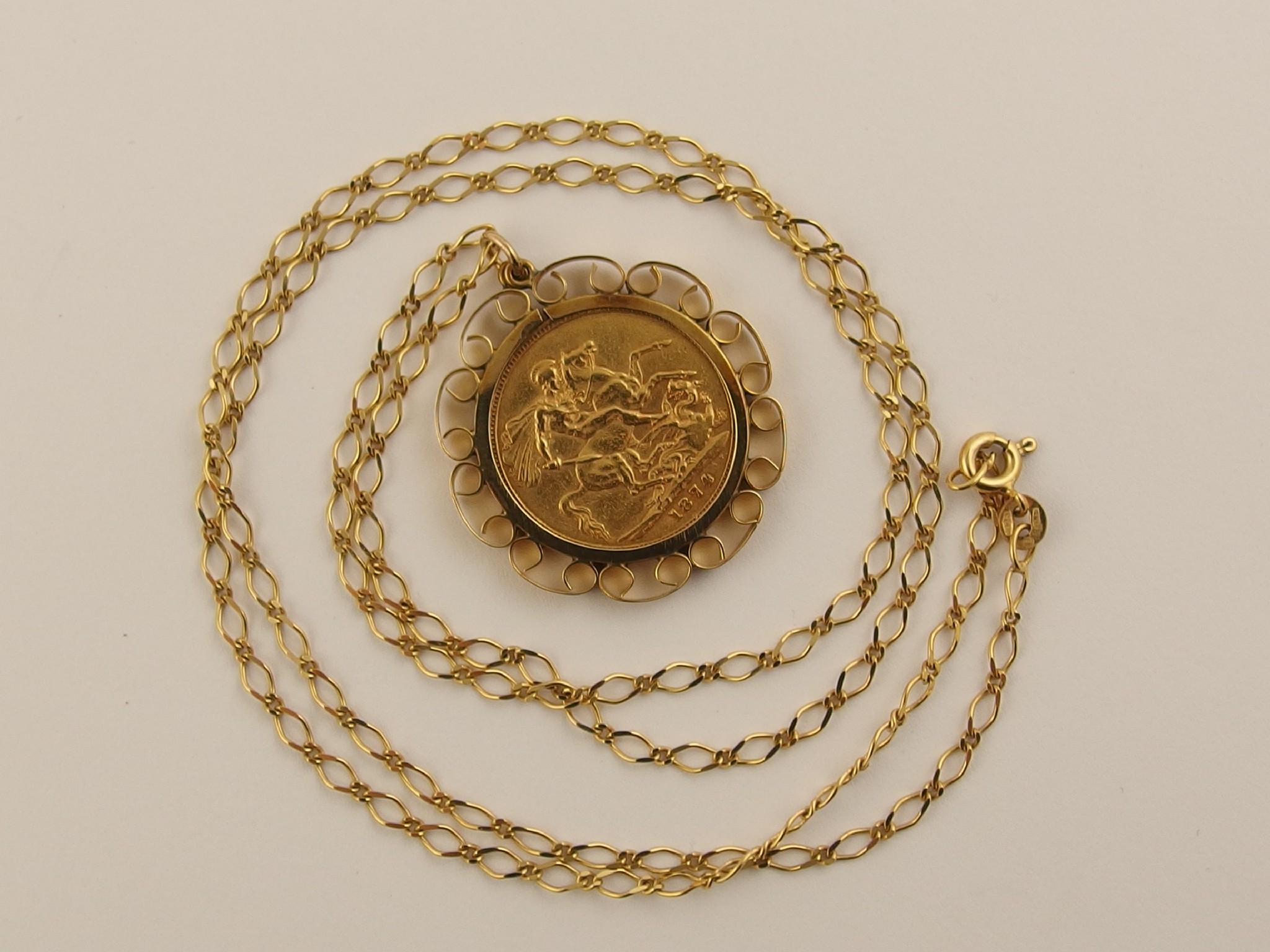 Appraisal: An full gold sovereign in a ct pendant mount with