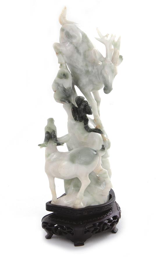 Appraisal: Chinese carved jade deer on rock formation Republic period mottled