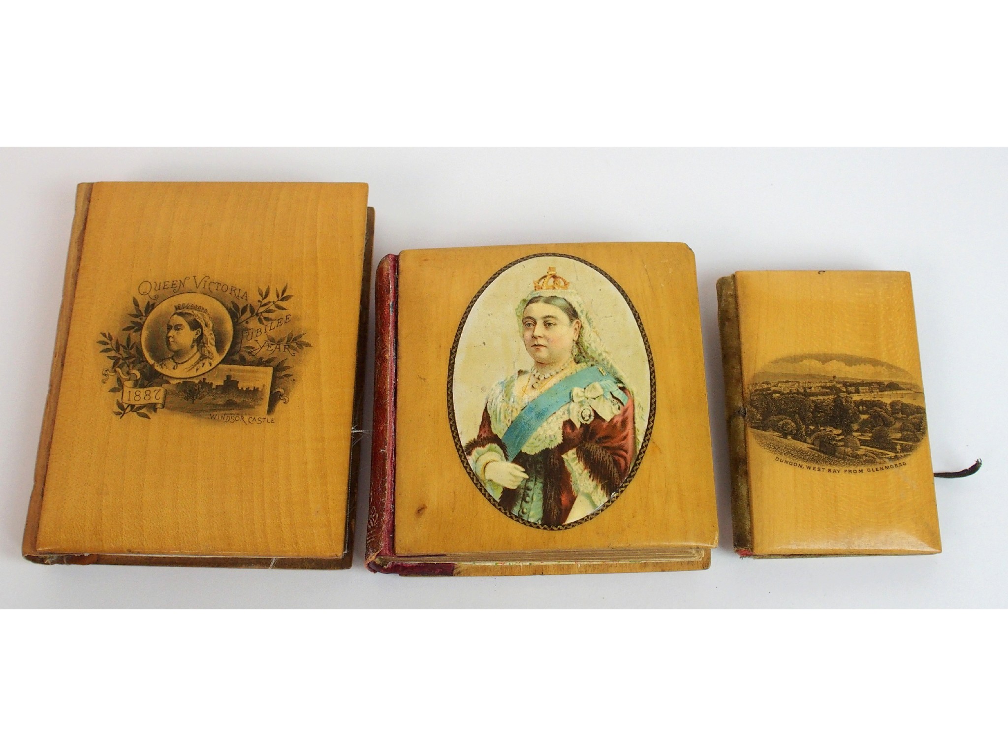 Appraisal: A group of Mauchline ware commemorative pocket booksa Queen Victoria