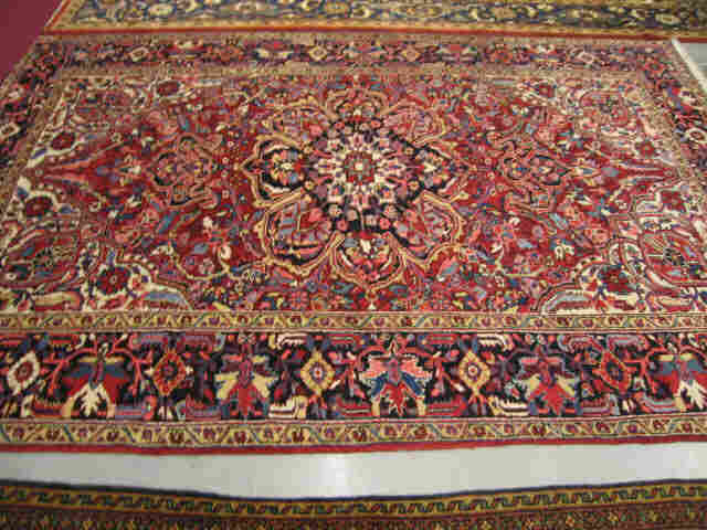 Appraisal: Heriz Persian Handmade Room Size Rug elaborate central medallion stylized