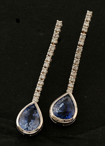 Appraisal: A pair of sapphire and diamond earrings Each articulated diamond