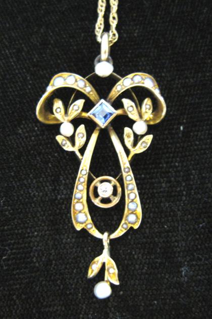 Appraisal: Low karat yellow gold synthetic sapphire and seed pearl pendantart