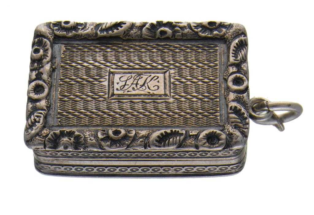 Appraisal: A GEORGE IV SILVER VINAIGRETTE the lid with foliate chased