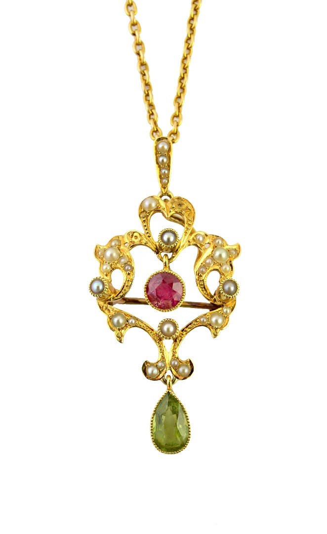 Appraisal: A gold peridot pink tourmaline and seed pearl set pendant