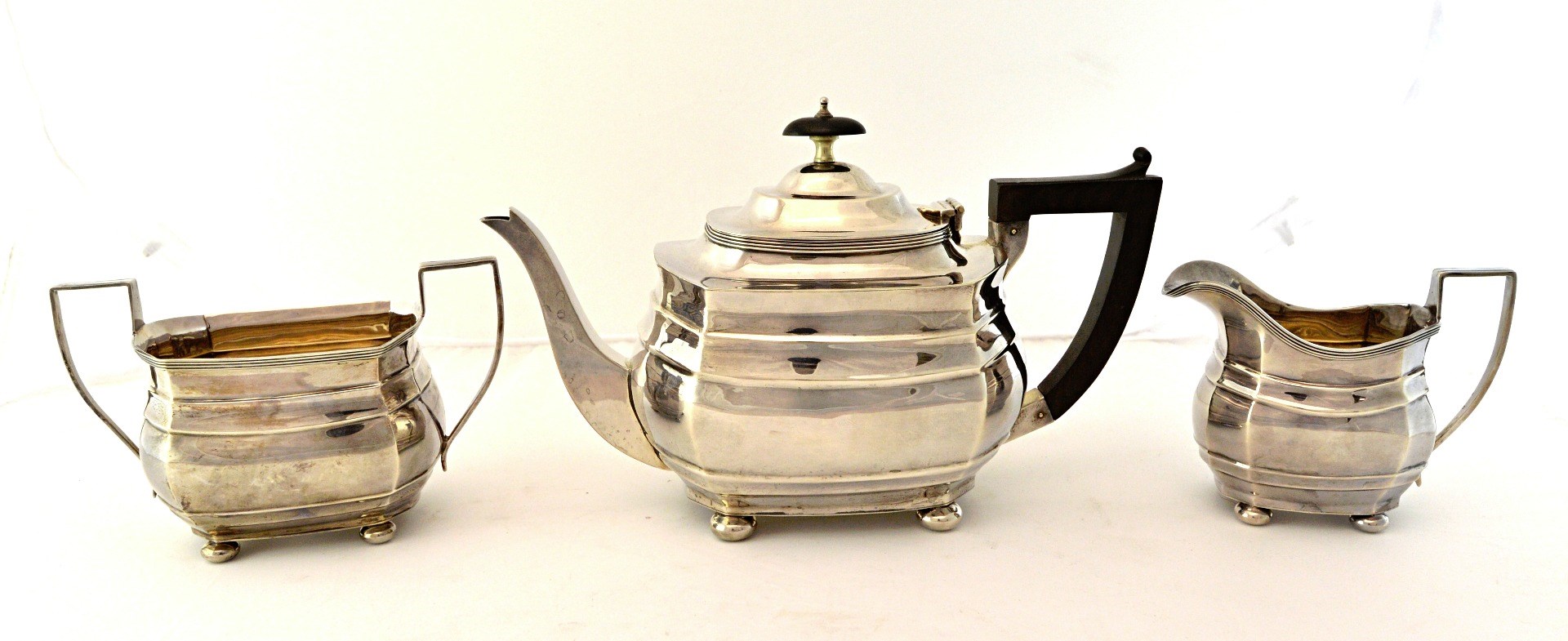 Appraisal: A silver three piece tea set comprising a teapot a