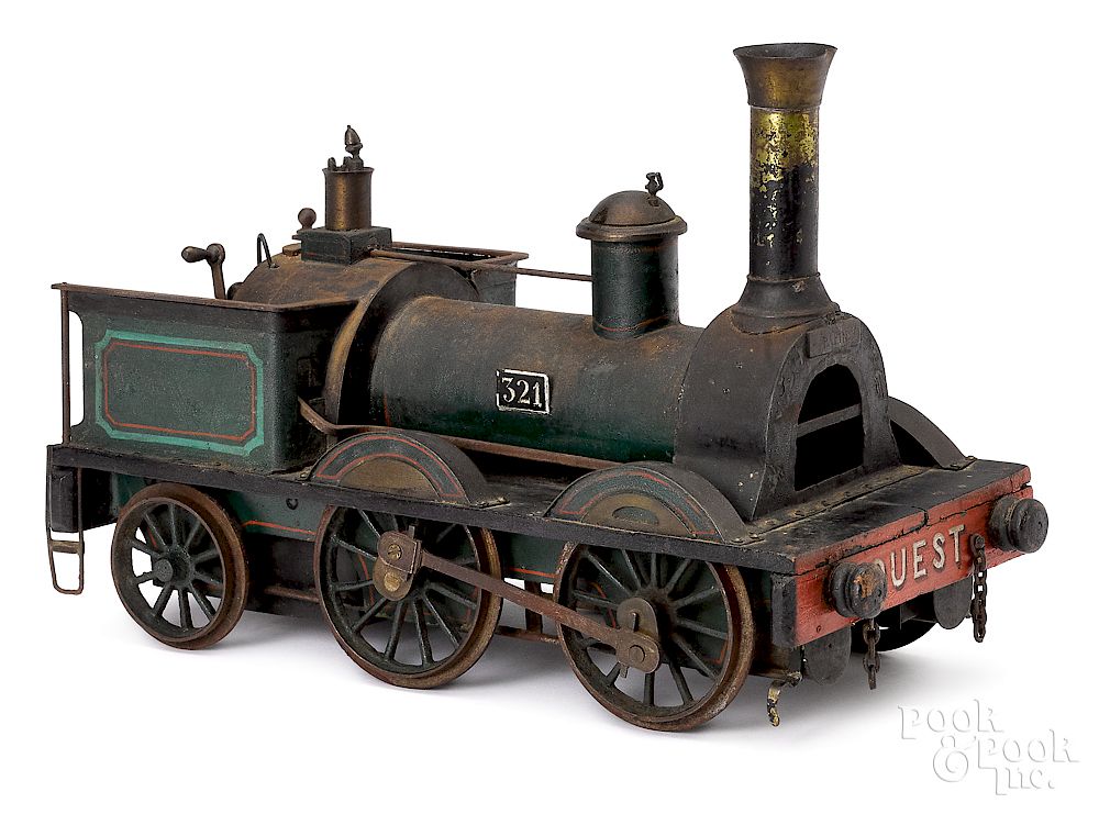 Appraisal: French painted tin and wood train locomotive Early French painted