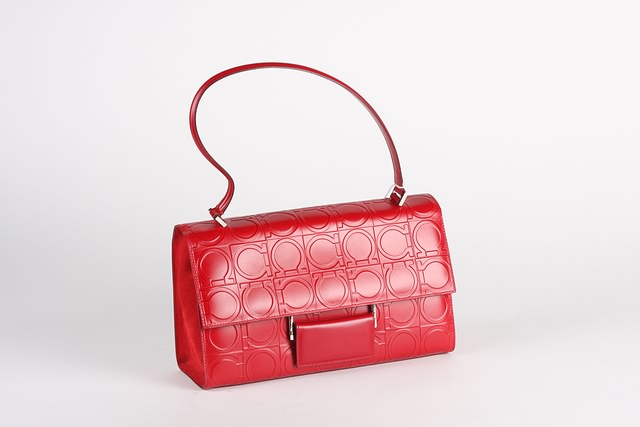 Appraisal: Salvatore Ferragamo red leather handbag signature embossed front closure silver