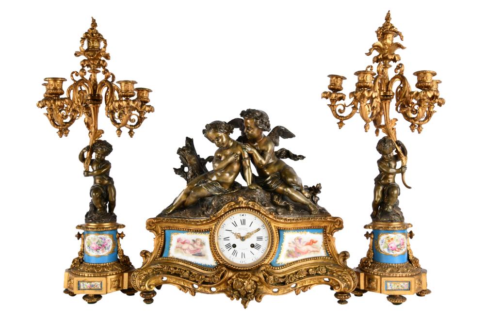 Appraisal: FRENCH GILT BRONZE PORCELAIN CLOCK GARNITUREcomprising a mantel clock signed