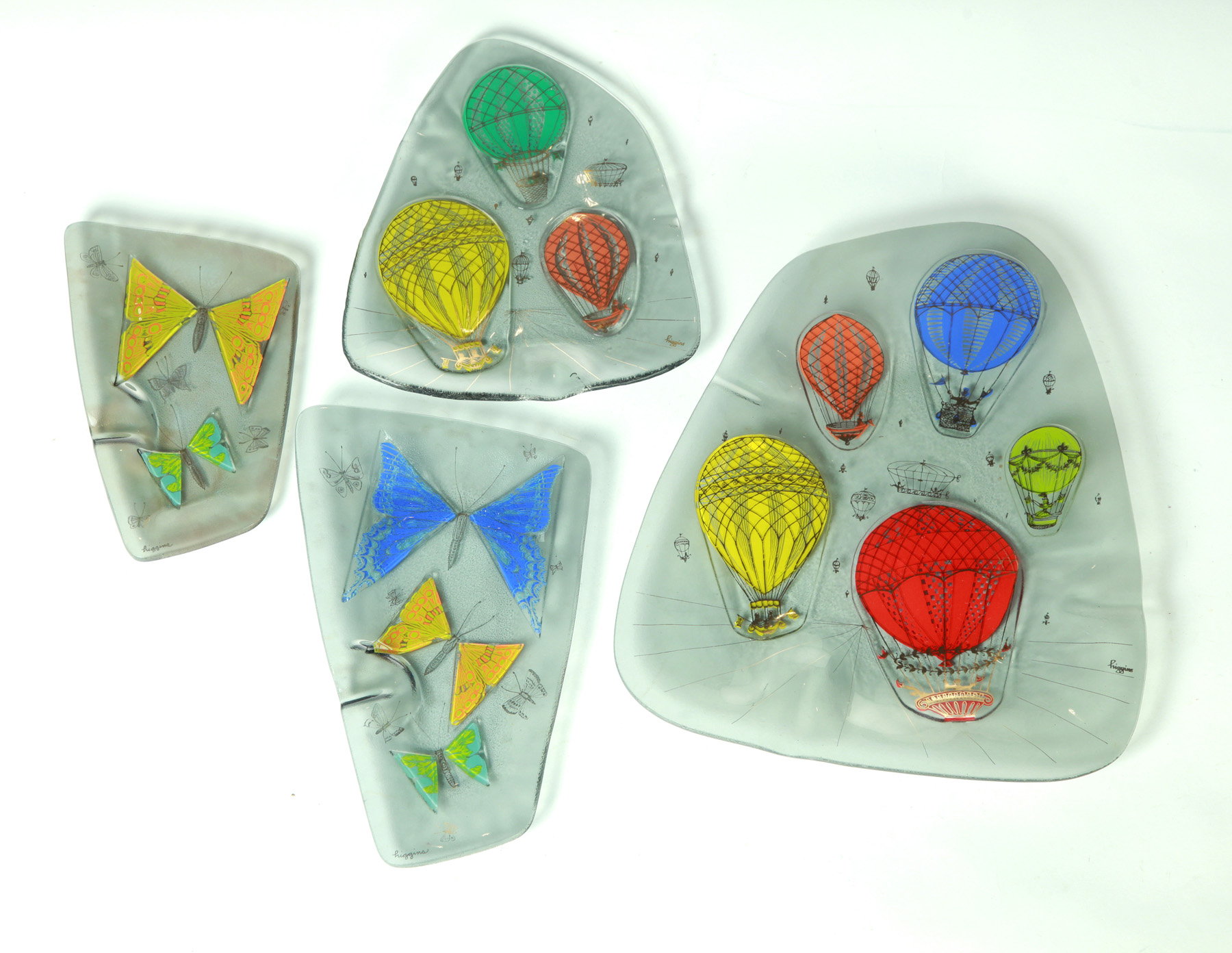 Appraisal: FOUR HIGGINS ART GLASS TRAYS WITH HOT AIR BALLOONS AND