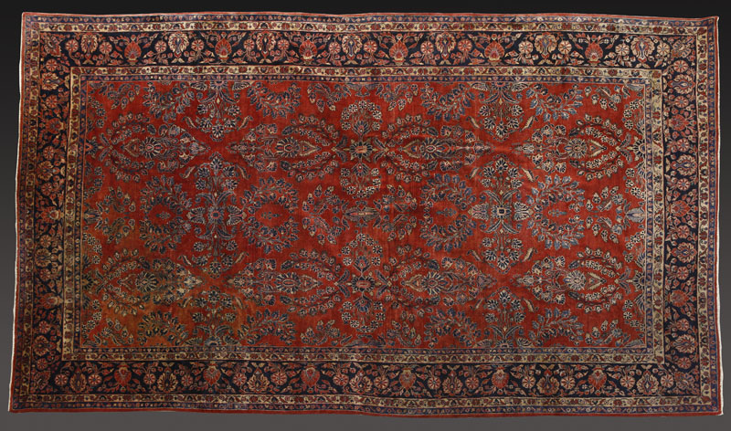 Appraisal: A large Persian Sarouk woolen carpet rug A large Persian