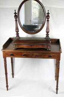 Appraisal: A Victorian mahogany washstand the three-quarter galleried top above two