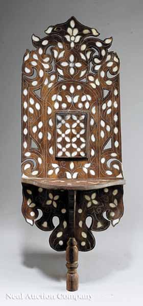 Appraisal: A Moroccan Mother-of-Pearl Inlaid Hardwood Bracket reticulated back shaped shelf