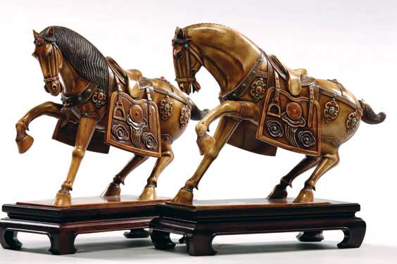 Appraisal: PAIR CARVED IVORY HORSES Pair of Chinese carved and stained