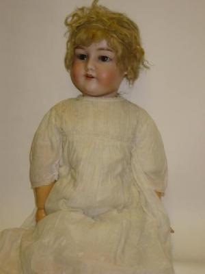 Appraisal: An Armand Marseille bisque head girl doll with brown glass