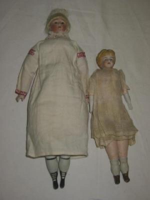 Appraisal: A bisque shoulder head doll with fixed brown glass eyes