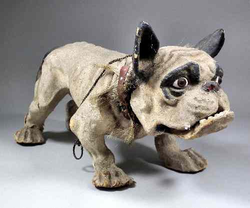 Appraisal: A late th Century French papier-mache pull-along Bulldog with opening