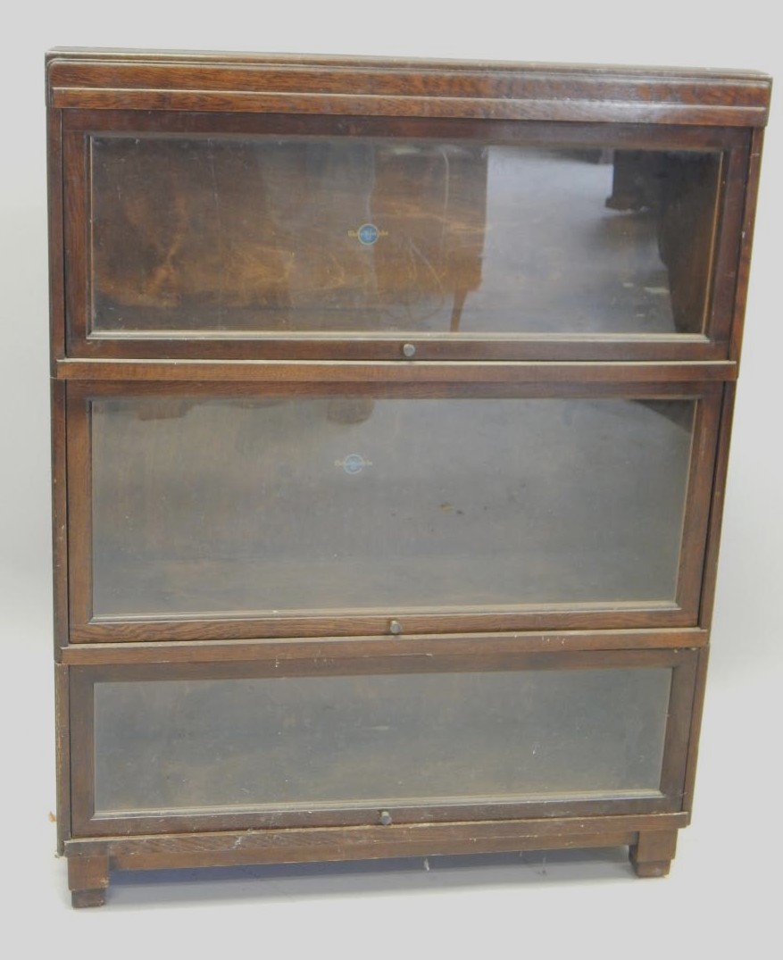 Appraisal: A Globe Wernicke three tier oak bookcase with metal knops