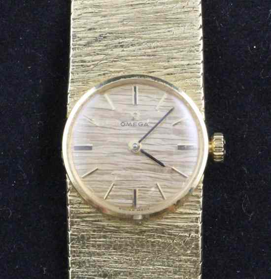 Appraisal: A lady's textured ct gold Omega bracelet watch the bark