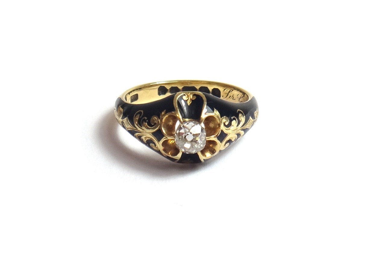 Appraisal: A Victorian gold black enamelled and diamond set mourning ring