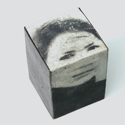 Appraisal: STUDIO Stoneware cube sculpture with a transfer-printed black and white