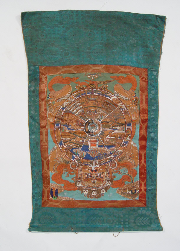 Appraisal: Oriental rectangular silk wall hanging decorated with a circular shield