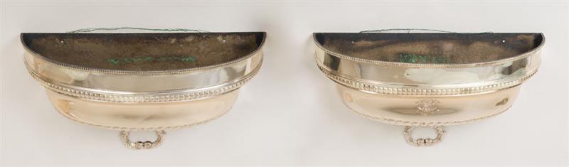 Appraisal: PAIR OF ENGLISH SILVER-PLATE DEMILUNE WALL JARDINI RES Formerly a