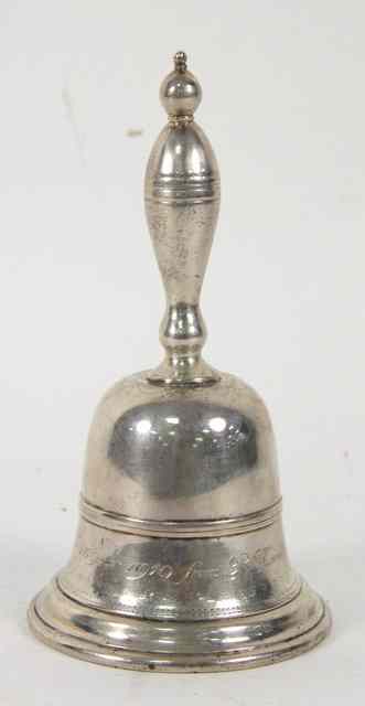 Appraisal: A Dutch silver table bell with turned handle and presentation