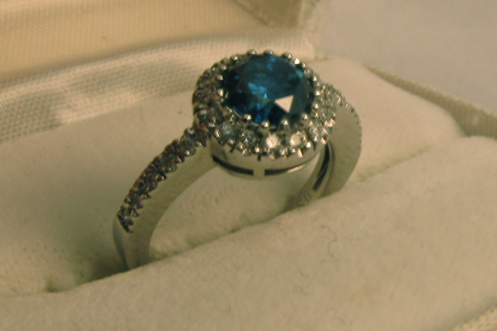 Appraisal: FANCY BLUE DIAMOND COLORLESS DIAMOND AND FOURTEEN KARAT WHITE GOLD