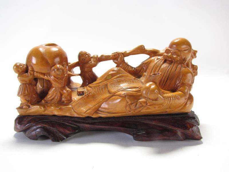 Appraisal: Carved Wood Figure of Confucius depicting a reclining Confucius being