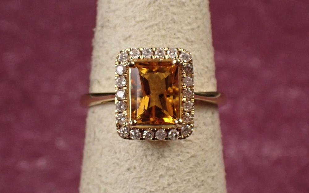 Appraisal: CITRINE DIAMOND AND FOURTEEN KARAT GOLD RING The yellow gold