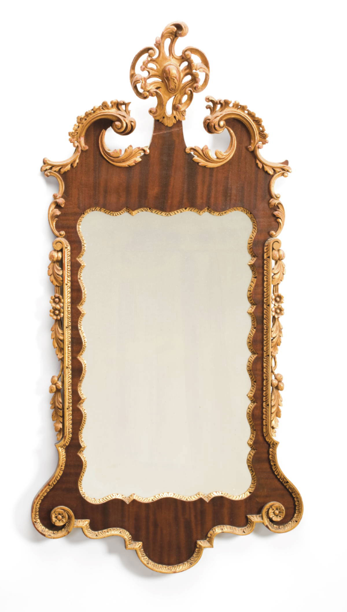 Appraisal: GEORGIAN MAHOGANY AND PARCEL-GILT WALL MIRROR The swan's neck crest